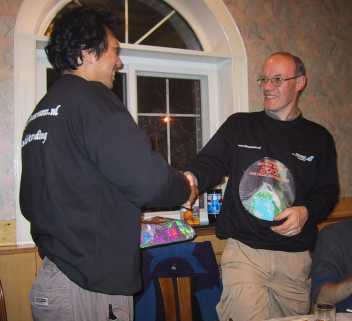 Casper ter Kuile hands over a present to Jin Zhu as an appreciation of all the work he carried out to make the expedition so successfull.
