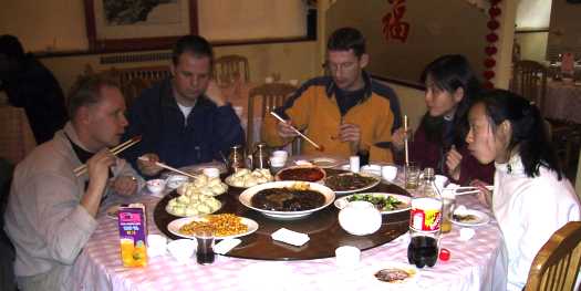 Expeditionmembers Sietse, Arnold and Jos together with our two students in a restaurant in Beijing